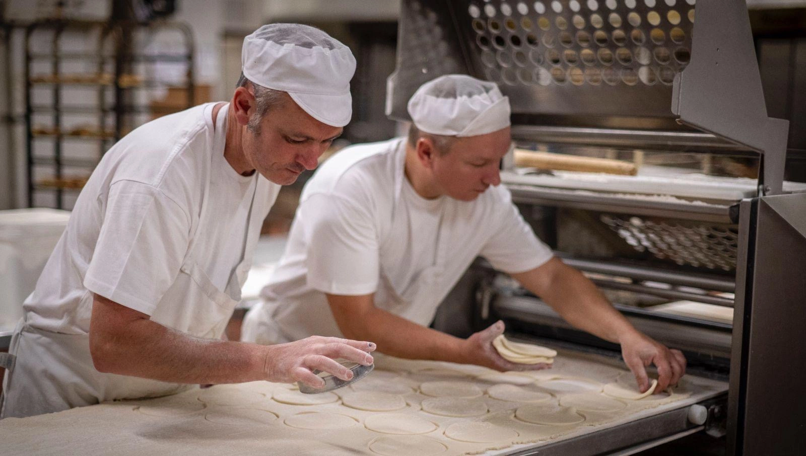 Bakers preparing pasties for the oven